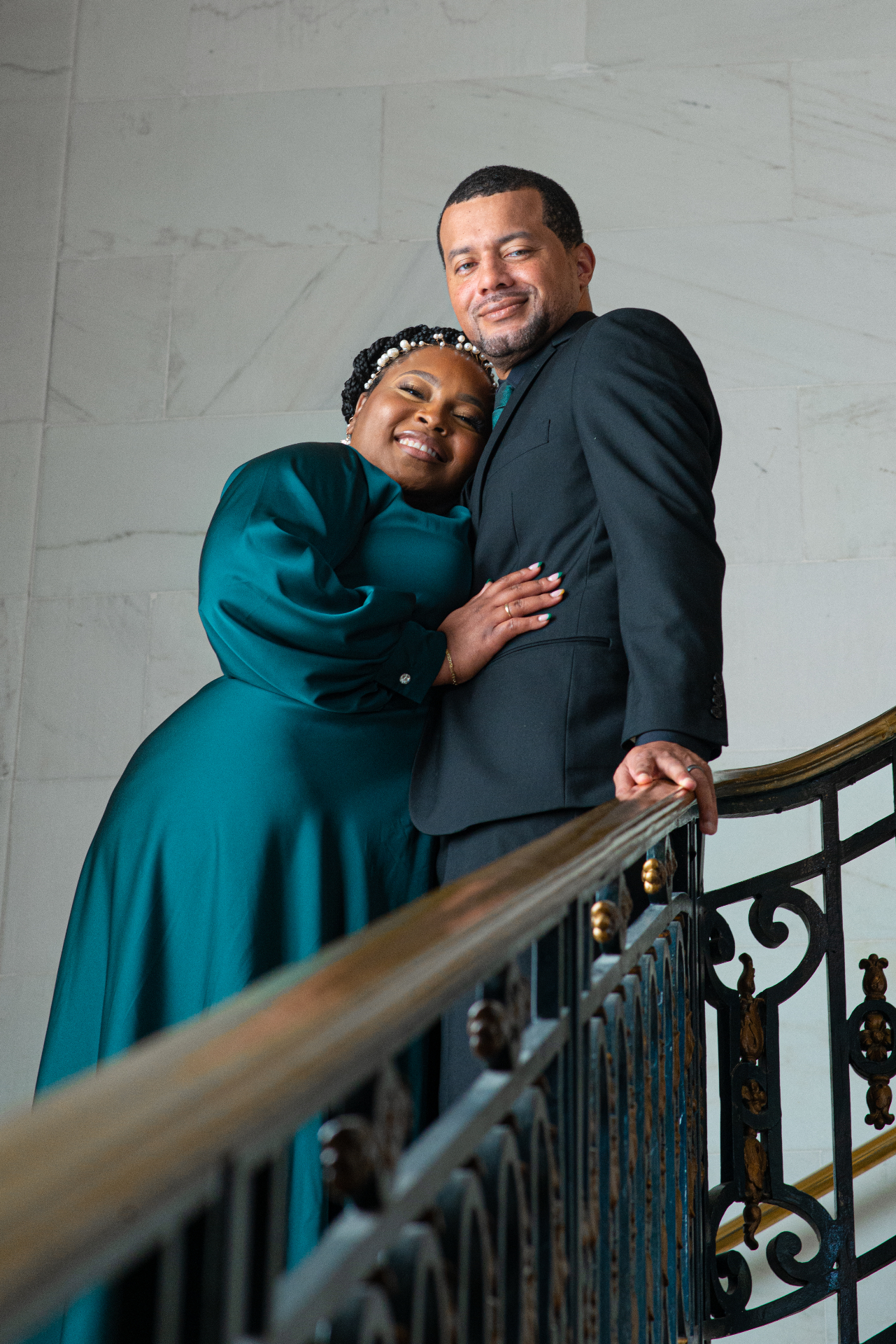 Elegant couple portrait on grand staircase