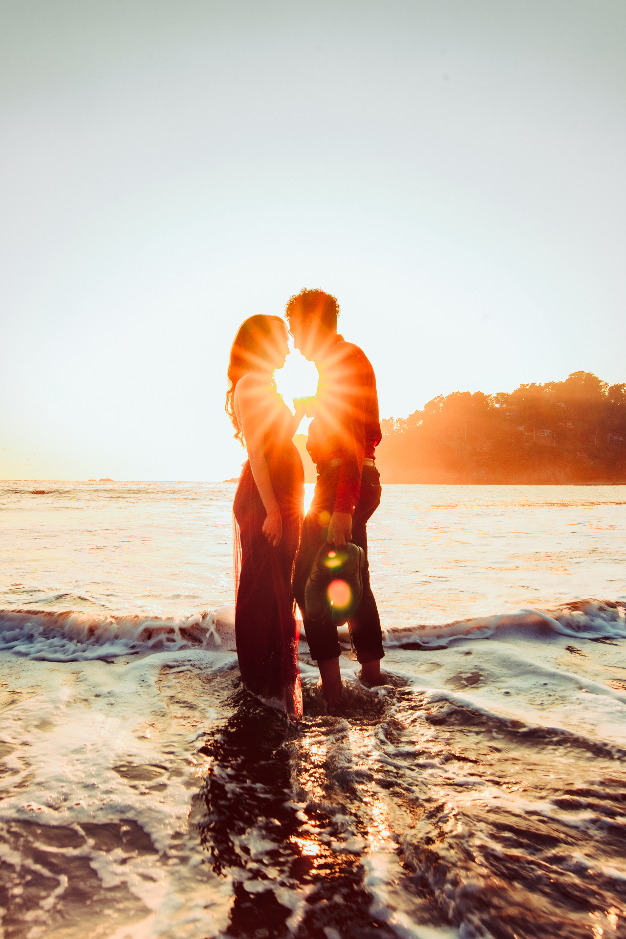 Engagement photography with golden hour sunburst