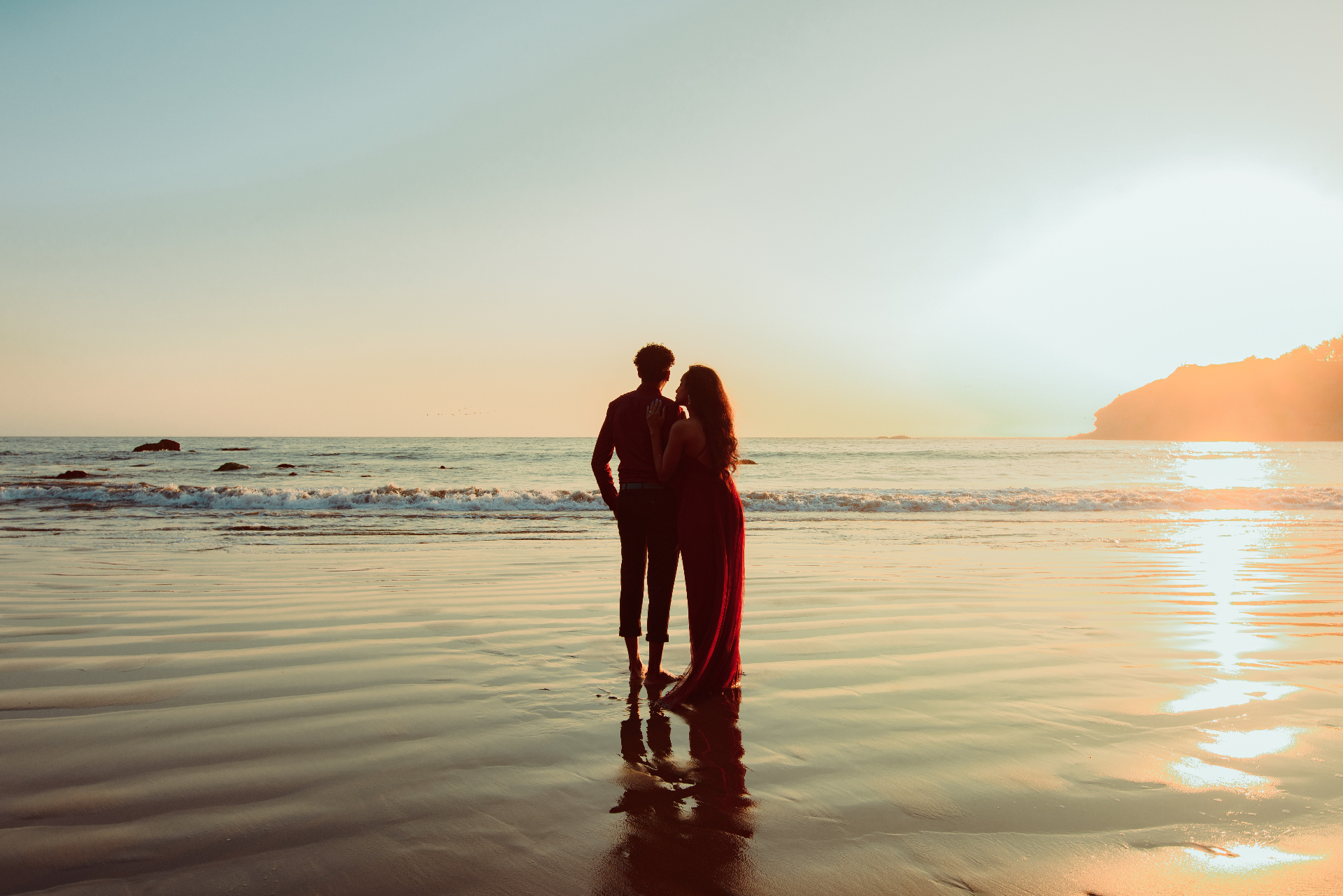 Romantic beach sunset engagement portrait